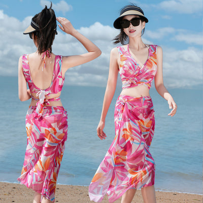 Women's light blue tropical leaf print three-piece swimsuit with short sleeve bikini top, bottoms, and sarong skirt. - Image 11