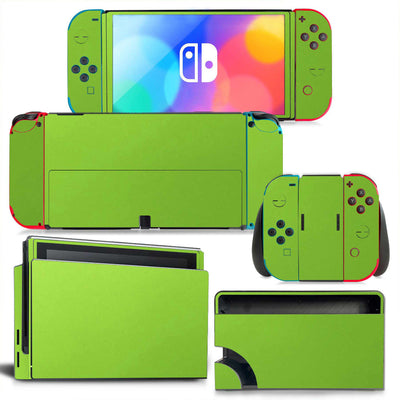 Yellow textured vinyl skin set for Nintendo Switch OLED console, Joy-Cons, and dock, shown disassembled. - Image 3