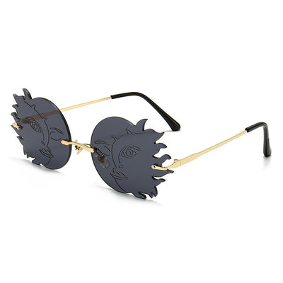 Orange sun-shaped rimless sunglasses with gold metal frames and black earpieces, featuring a smiling face design.