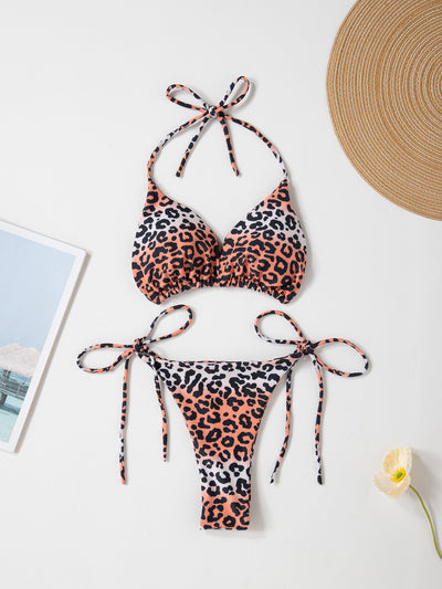 Red solid color two-piece bikini swimsuit with a halter tie-top and adjustable tie-side thong bottom. - Image 16