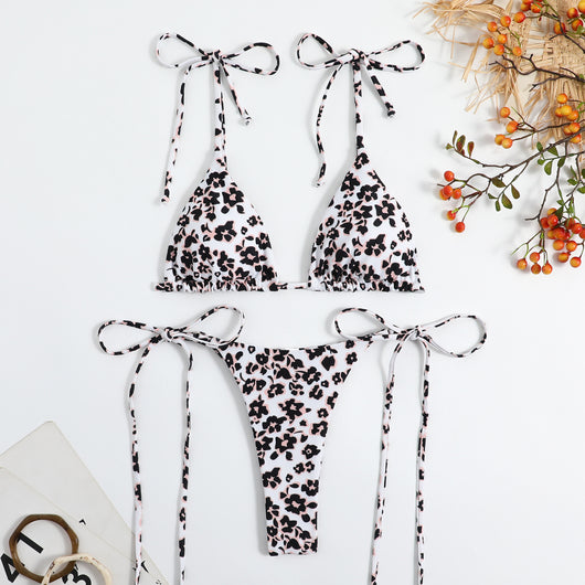 Vibrant floral print bikini set with tie-side triangle top and matching bottoms, featuring pink, blue, orange, and purple flowers. - Image 15