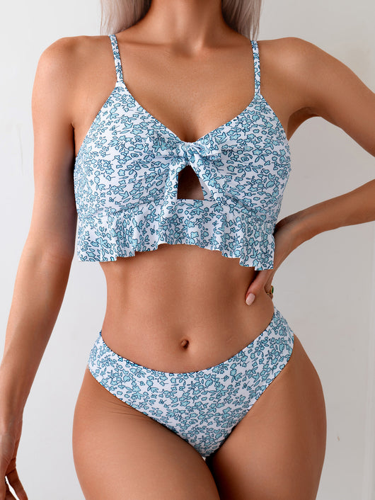Women's blue and white floral print two-piece set with ruffled crop top and matching mini skirt. - Image 9