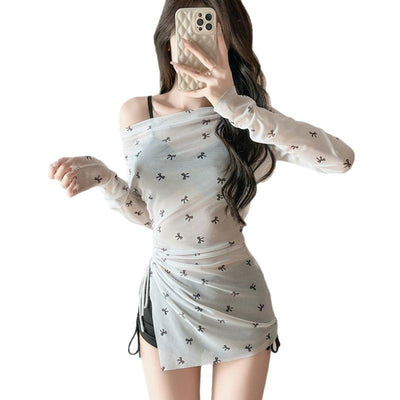 Women's three-piece swimwear with a black bikini and a sheer white off-shoulder long-sleeve bow print cover-up. - Image 4