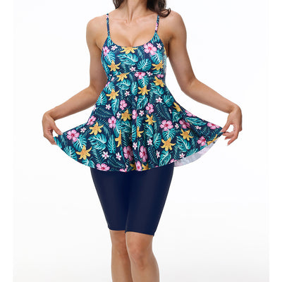 Women's navy blue two-piece swimsuit with white floral tankini top and matching solid swim shorts. - Image 6