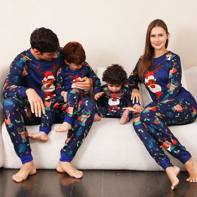 Family Christmas pajamas with a cartoon reindeer wearing a Santa hat and red scarf on a black top, and dark blue pants with a repeating reindeer and holly patte - Image 4