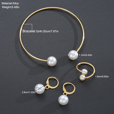 Gold-tone open cuff bracelet, matching open ring, and dangle earrings, all featuring white faux pearls. - Image 6