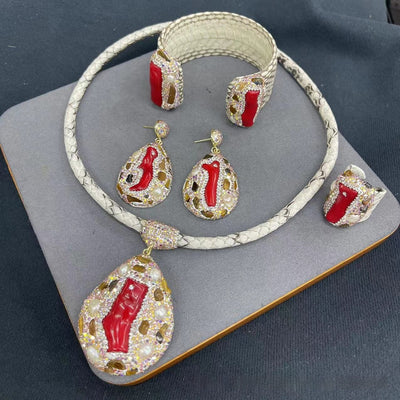 Four-piece jewelry set with white snakeskin leather, red coral-like inlays, pearls, and gemstones. - Image 6