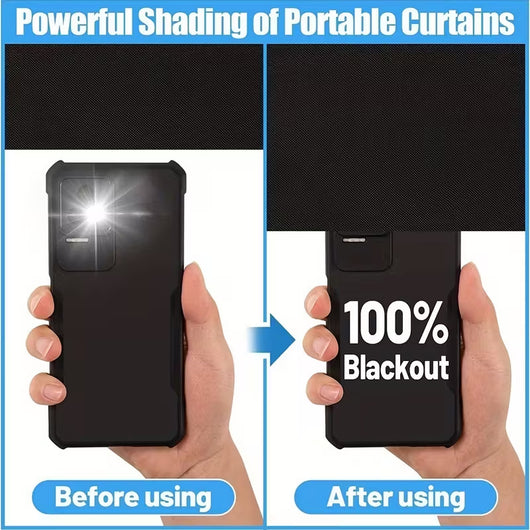 Black portable sunshade curtain partially installed on a window, showing a city view, with adhesive strips and a storage bag. - Image 3