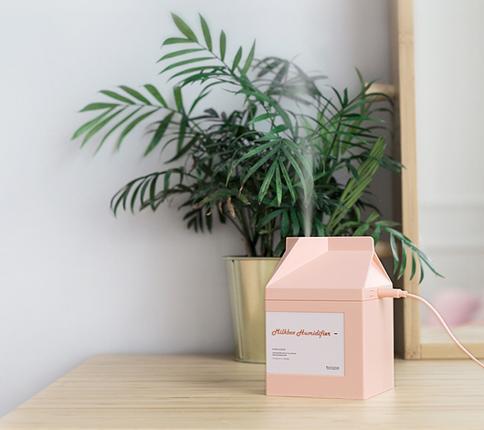 Pink milk carton shaped humidifier with a white label, featuring "Milkbox Humidifier" text and a bcase logo. - Image 11