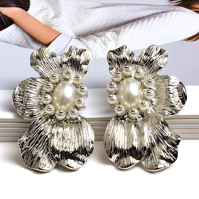 Aretes de Flores Exageradas con Metal Simétrico - Estilo Europeo y Americano - Image 9