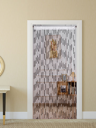 Brown and beige striped string curtain with twisted tassel texture, held by a hand, for living room partition. - Image 4