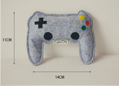 Light blue felt catnip toy shaped like a game controller with piano keys and a black string for hanging. - Image 8
