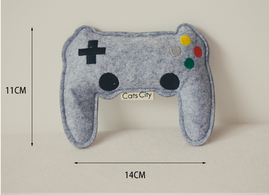 Light blue felt catnip toy shaped like a game controller with piano keys and a black string for hanging. - Image 8
