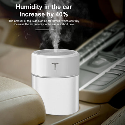 White and clear cylindrical mini humidifier with a 'T' logo, featuring a top mist outlet and transparent water tank. - Image 7