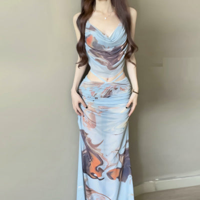 Purple and brown tie-dye two-piece swimsuit with a ruched cowl neck halter top and a matching high-waisted skirt. - Image 2