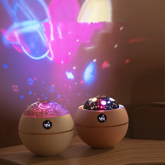 Pink spherical humidifier with a white top, ribbed texture, rose gold band, and a digital display showing 73%.