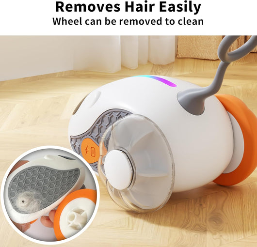 Interactive cat toy with white robotic base, orange wheels, and feather attachment, controlled by a remote, with a cat looking on. - Image 3