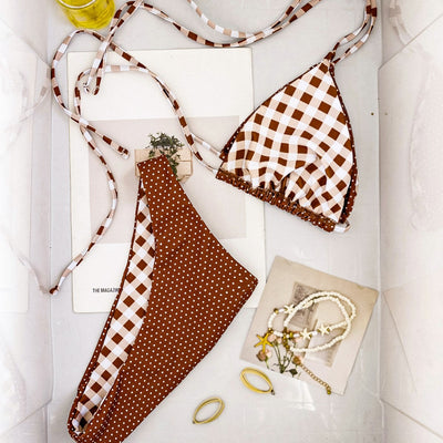 Retro brown and white plaid triangle bikini top with matching polka-dot bottoms, displayed flat with accessories. - Image 2