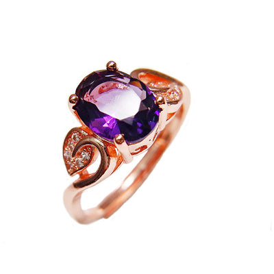 Rose gold necklace with a teardrop purple gemstone pendant and matching dangle earrings. - Image 8