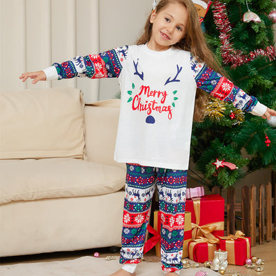 Family of four wearing matching white and red/blue Christmas pajamas with reindeer antlers and 'Merry Christmas' text. - Image 9