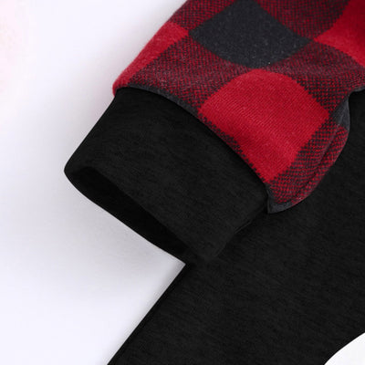 Kids' Christmas pajamas with a black long-sleeve top featuring a cartoon bear in a plaid scarf and ice skates, paired with red and black plaid pants. - Image 23