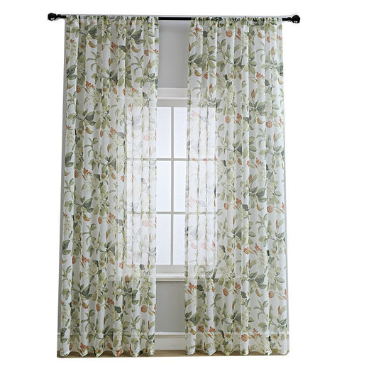 Dark gray semi-sheer curtains with a white and green floral pattern, hung on a black rod in a living room. - Image 5