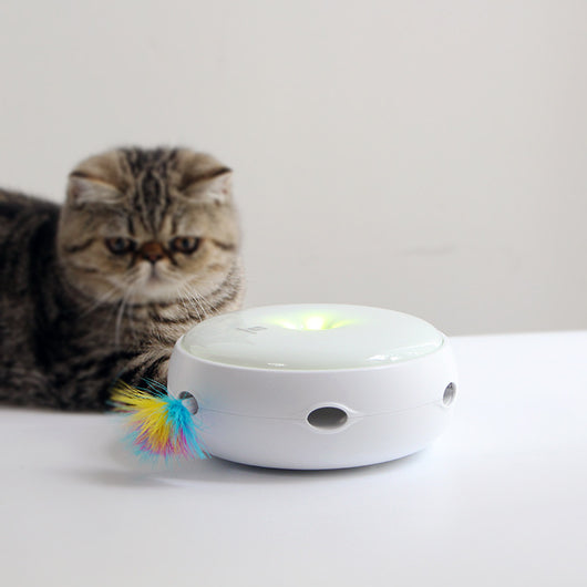 White electric cat toy with a colorful feather attachment and four AA batteries for interactive pet play. - Image 8