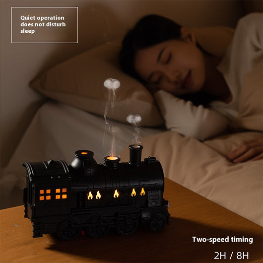 Black train-shaped essential oil diffuser and humidifier with retro design, emitting mist and glowing lights. - Image 2