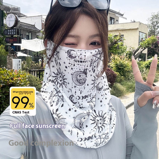 Black paisley sun mask with white pattern and ear loops, covering the lower face and neck, worn outdoors.