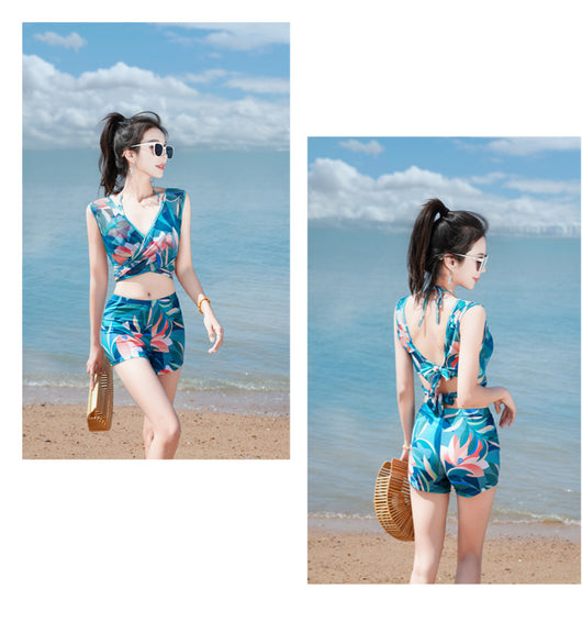 Women's light blue tropical leaf print three-piece swimsuit with short sleeve bikini top, bottoms, and sarong skirt. - Image 26