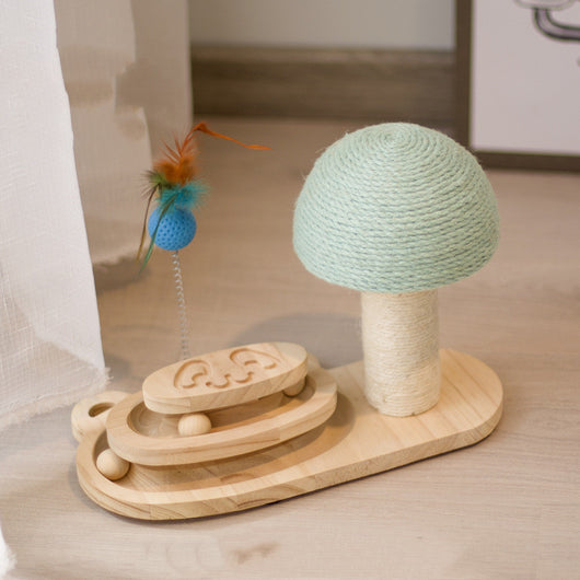 White cat playing with a wooden multi-level track toy featuring a spring-mounted yellow feather ball and a green catnip ball. - Image 21