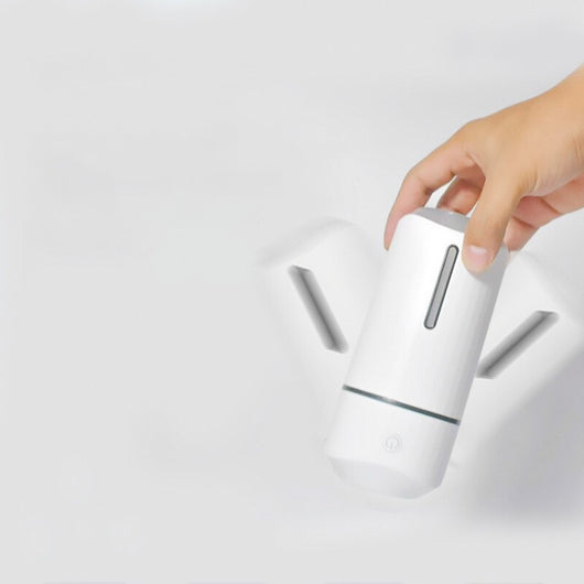 Pink columnar mini car humidifier with a power button and a clear water level indicator on a white background. - Image 4