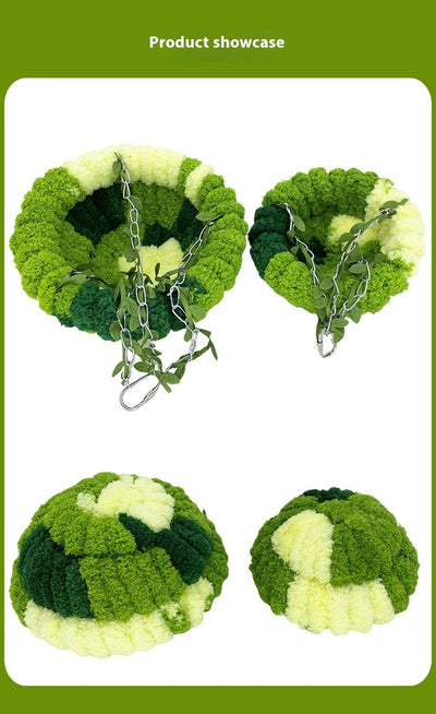 Small forest style plush bird hammock in green and yellow, hanging from a chain with artificial leaves. - Image 8