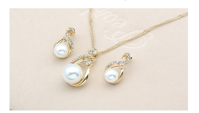 Gold-tone necklace and matching earrings set with white faux pearls and clear rhinestones, ideal for bridal or dinner wear. - Image 15
