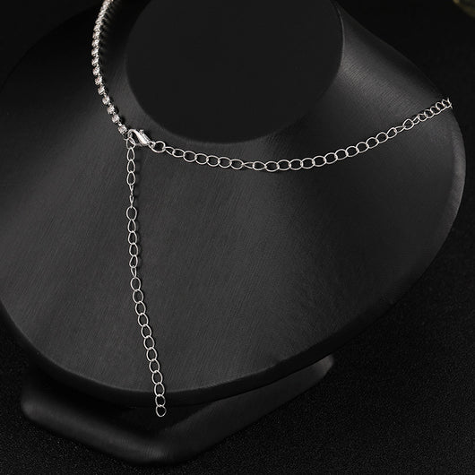 Elegant silver-tone necklace and matching drop earrings set with clear marquise and teardrop stones, displayed on a black bust. - Image 4