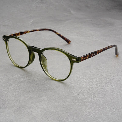Fashionable round-frame sunglasses with transparent gray frames and dark gray lenses on a gray surface. - Image 18