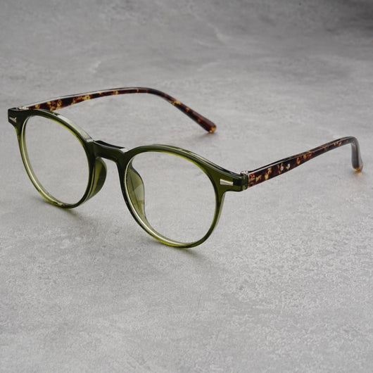 Fashionable round-frame sunglasses with transparent gray frames and dark gray lenses on a gray surface. - Image 18