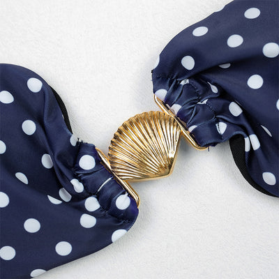 Woman in a navy blue polka dot tube top bikini and matching maxi skirt with side ties, posing outdoors. - Image 17