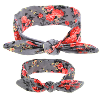 Two blue headbands with white polka dots and knotted bows, one adult-sized and one child-sized, for a matching set. - Image 6