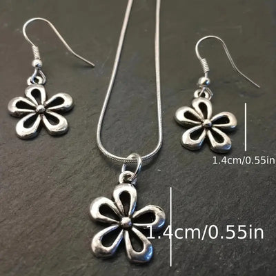 Silver-colored snake chain necklace with a delicate flower pendant and an adjustable lobster clasp closure. - Image 2