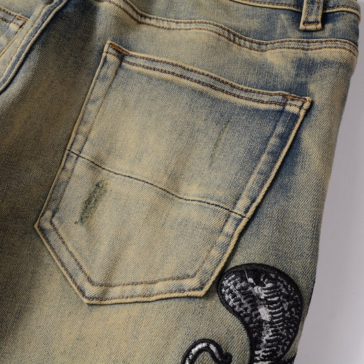 Jeans Slim Fit Desgastados con Bordado de Serpiente de Tres Cabezas y Parches de Cuero - Image 12
