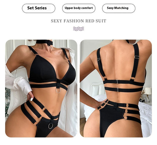 Woman wearing a royal blue strappy lingerie set with O-rings, including a bra, high-waisted bottoms, and a choker. - Image 10