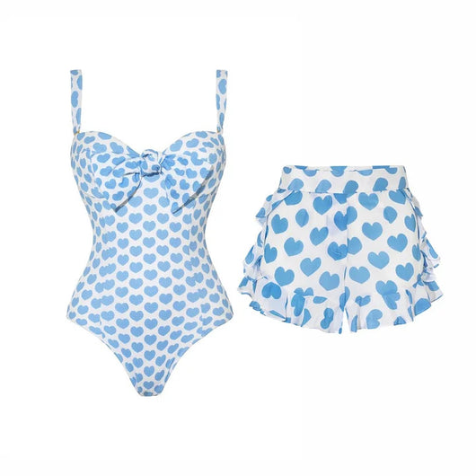 White shorts with blue heart print and ruffled sides, perfect for a fun vacation or casual summer day. - Image 11