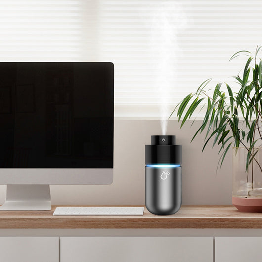 White car mini spray air purifying humidifier with a yellow light ring and a power button icon. - Image 2