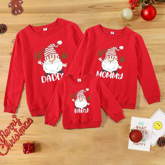 Family matching white long-sleeve crew neck tops with a cute snowman face print, featuring black eyes, an orange carrot nose, and a dotted smile. One adult top - Image 8