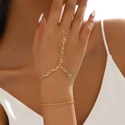 Gold-tone layered bracelet ring with clear crystal accents and a finger loop, featuring a lobster clasp closure. - Image 2