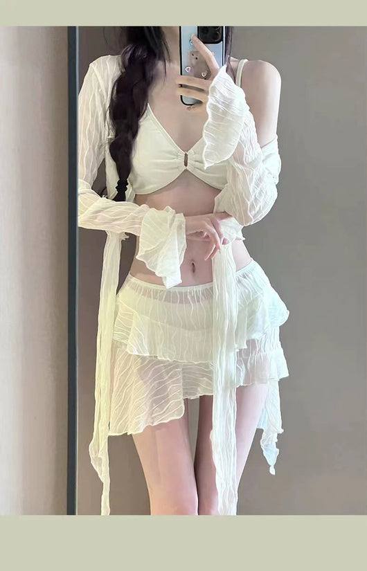 White four-piece bikini swimsuit set for women, featuring a long-sleeve tie-front top and tiered ruffle skirt. - Image 10