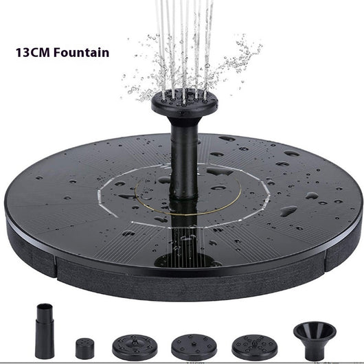 5W solar fountain kit with black solar panel on a ground stake, water pump, coiled hose, and various nozzles. - Image 4