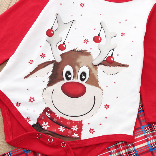 Red and white family Christmas pajamas with a reindeer graphic on the tops and red plaid pants, including a baby romper and hat. - Image 17