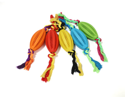 Green rubber pet molar toy with a football shape and textured surface, featuring red and green braided rope knots. - Image 14
